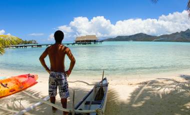 Man and canoe in Tahiti